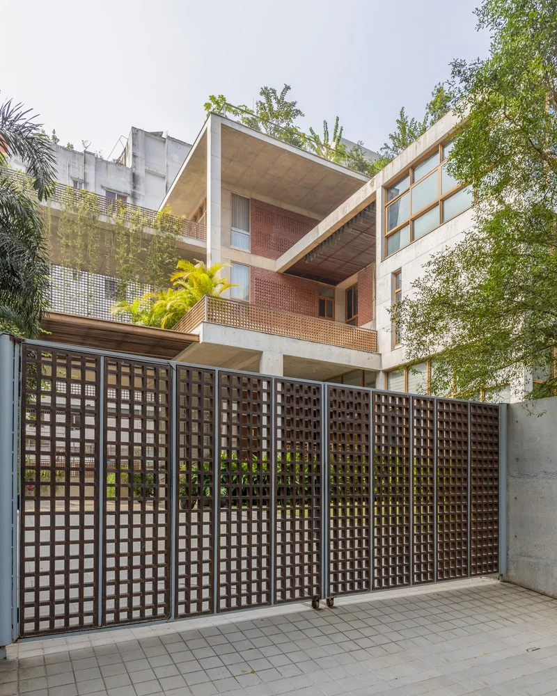 Ahsan Residence in Dhaka, with layered street edge, gate, material and planted terraces